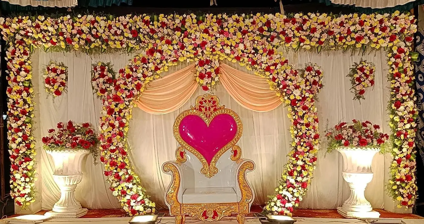 Engagement stage with floral heart and royal chair