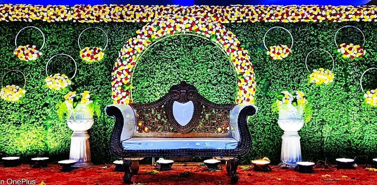 Engagement stage with hanging lights and florals