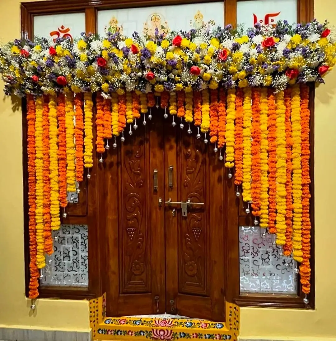 Marigold arch over a carved door