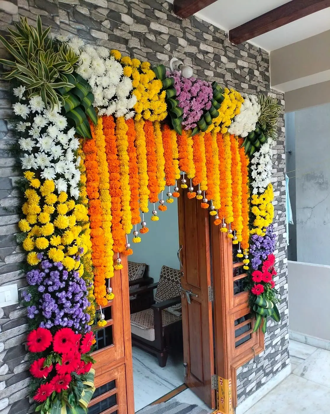Tall flower arch at a home entrance