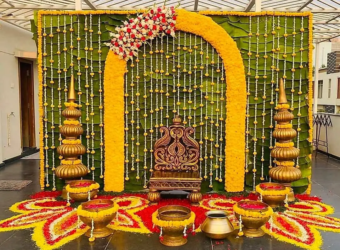 Haldi seat with banana leaves and brass pots