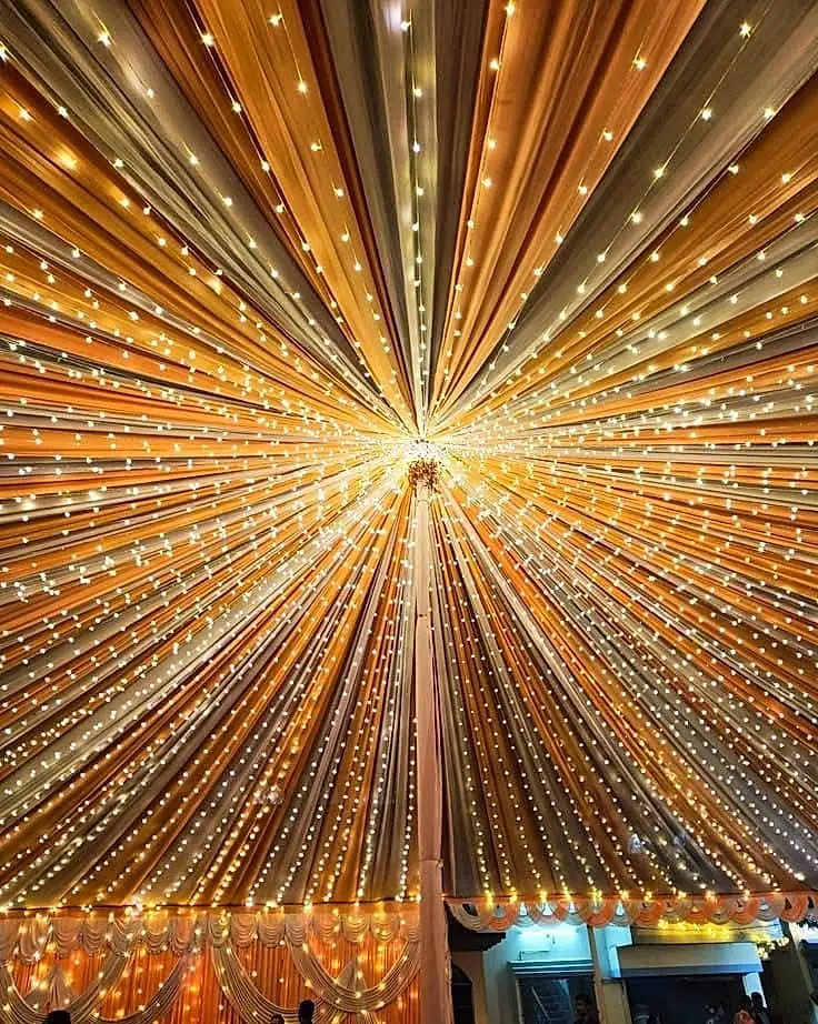Cloth pandal ceiling with golden lights