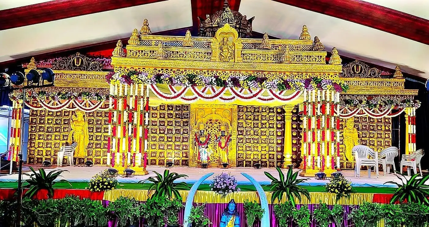 Carved gold pelli mandapam with temple-style crown