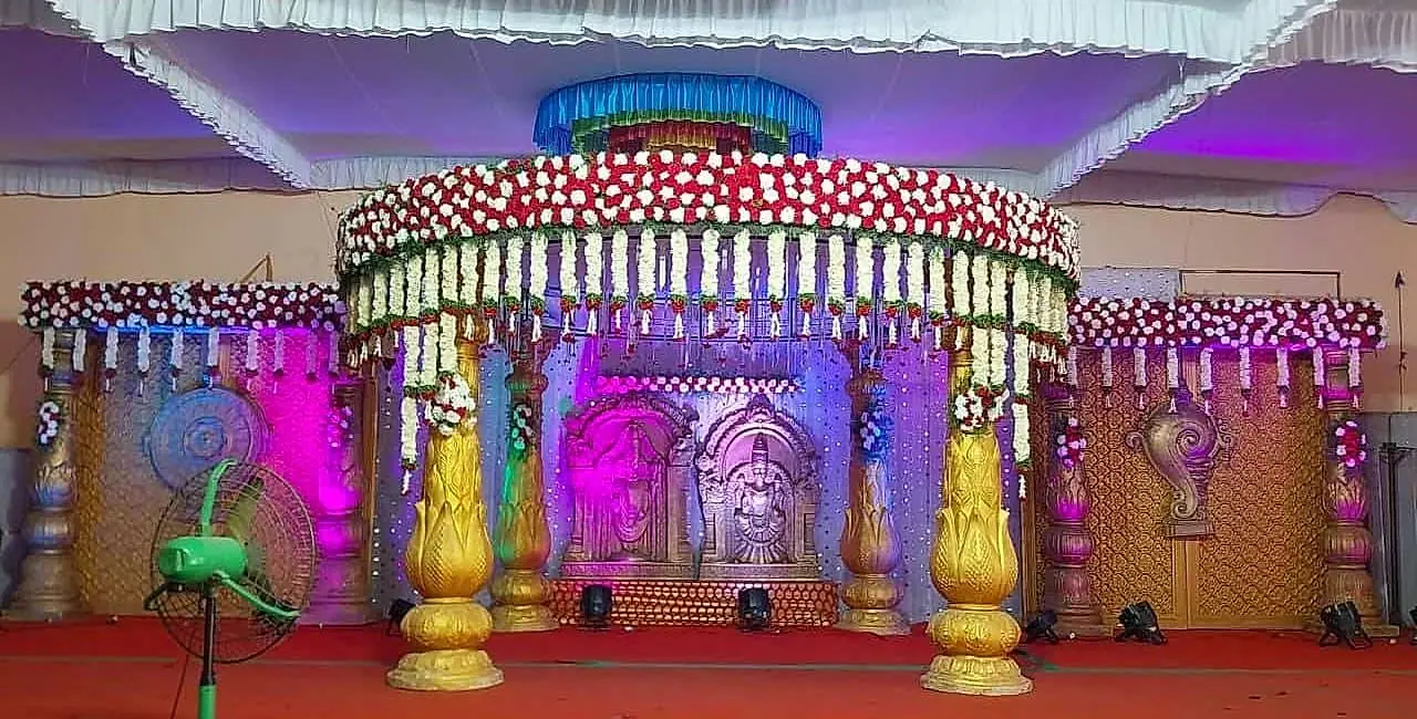 Pelli mandapam lit in purple and gold