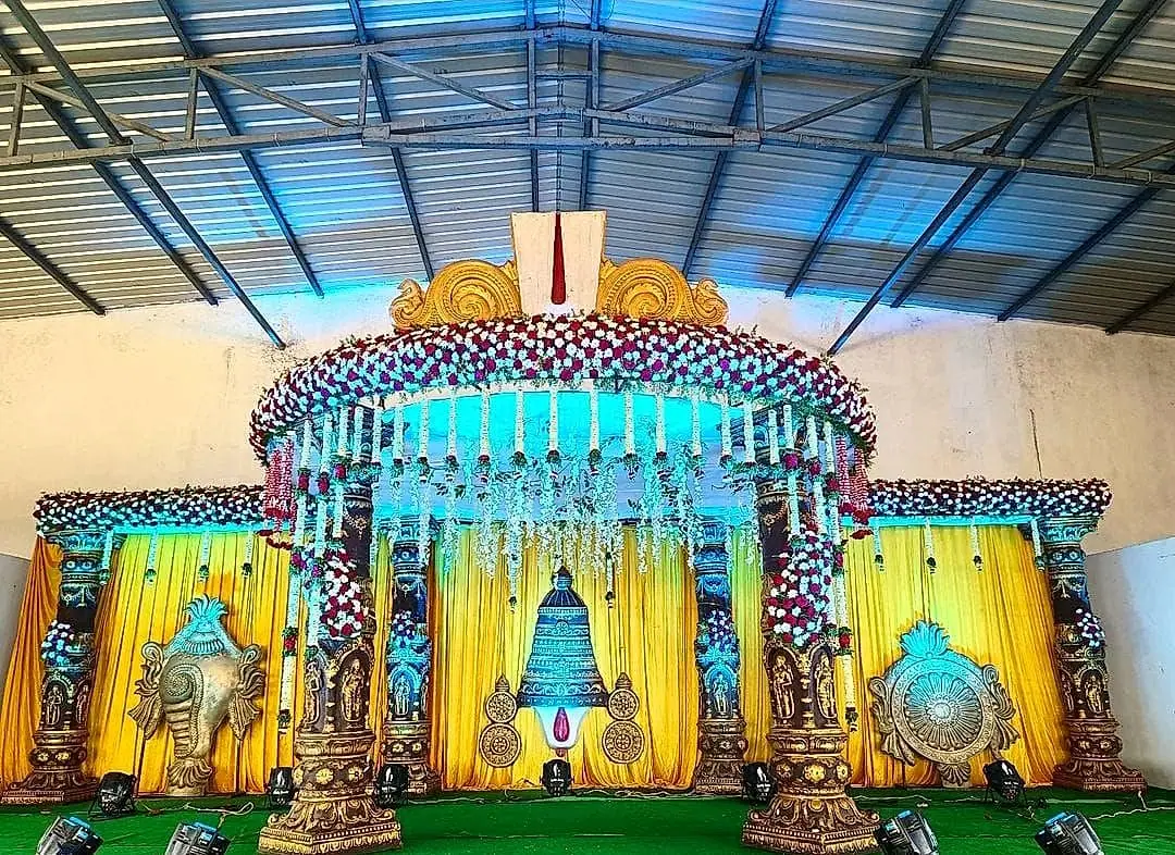 Mandapam with blue lighting and floral canopy