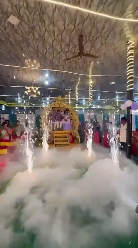 Couple's throne entry with sparks and fog